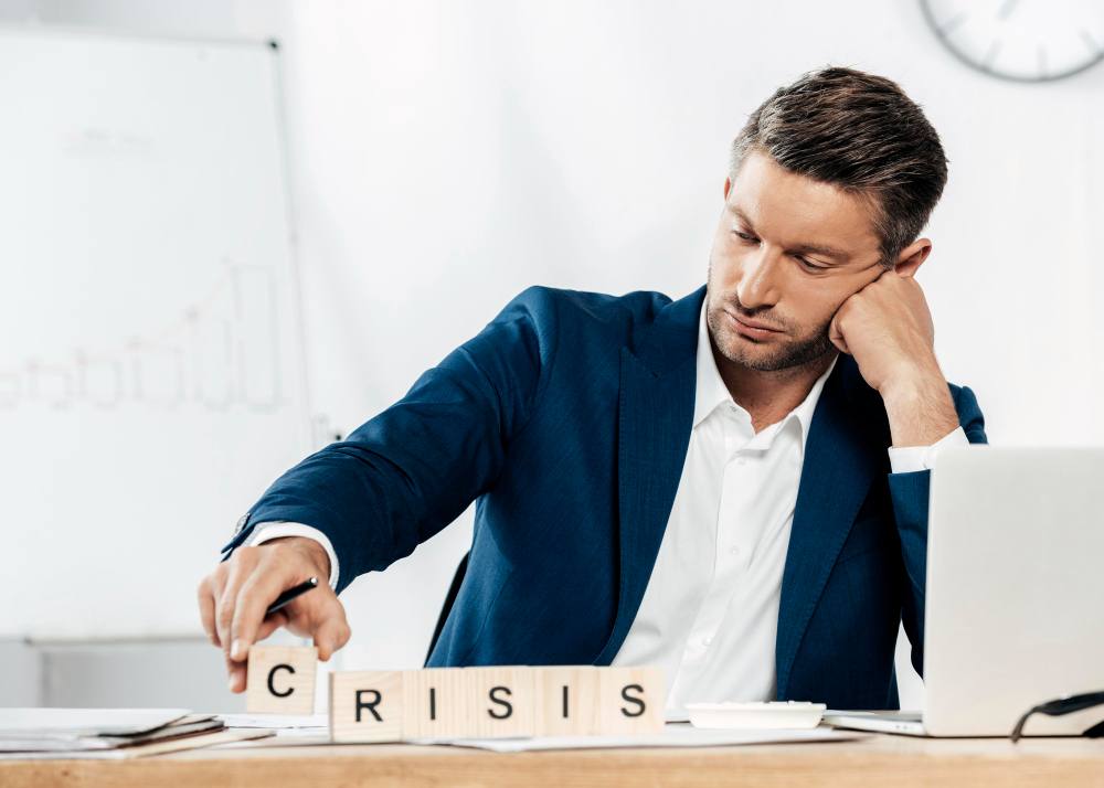 An office executive is planning about crisis (illustration)
